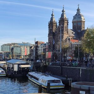 Autumn canal view with Basilica of Saint Nicholas – Amsterdam (Netherlands)